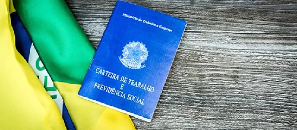 Brazilian work document and social security document on the table (Carteira de Trabalho)